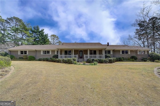 ranch-style house featuring a porch and a front yard