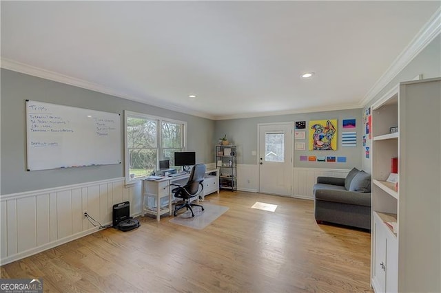 office area with crown molding, light hardwood / wood-style floors, and a wealth of natural light