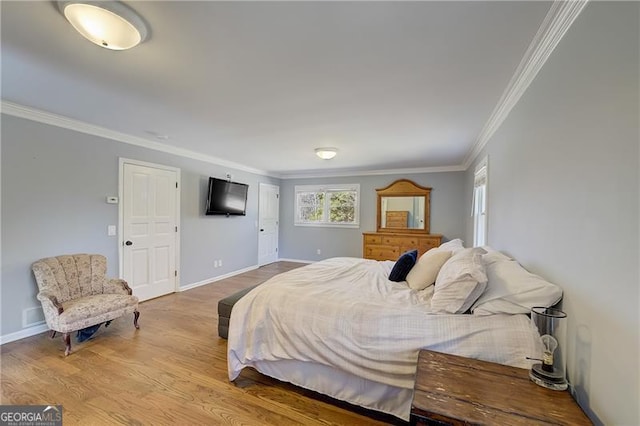 bedroom featuring crown molding and light wood-type flooring