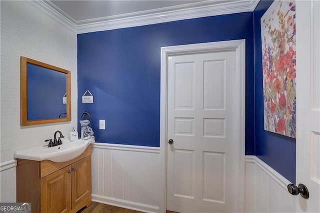 bathroom featuring vanity and ornamental molding