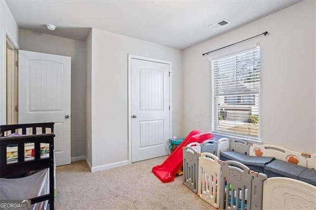 carpeted bedroom featuring a closet