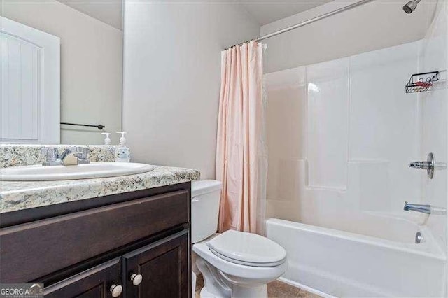 full bathroom featuring vanity, shower / tub combo, and toilet