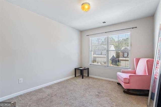 sitting room with light carpet