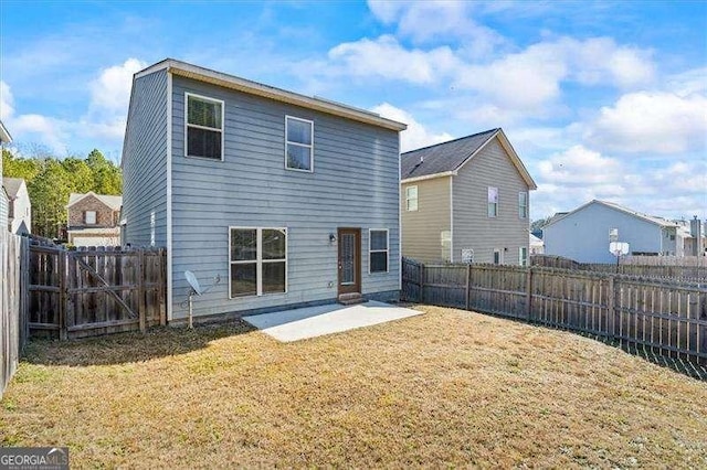 back of property featuring a lawn and a patio