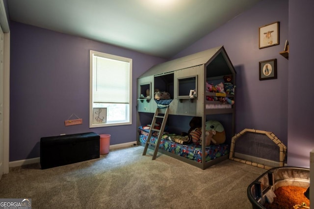 bedroom featuring lofted ceiling and carpet flooring