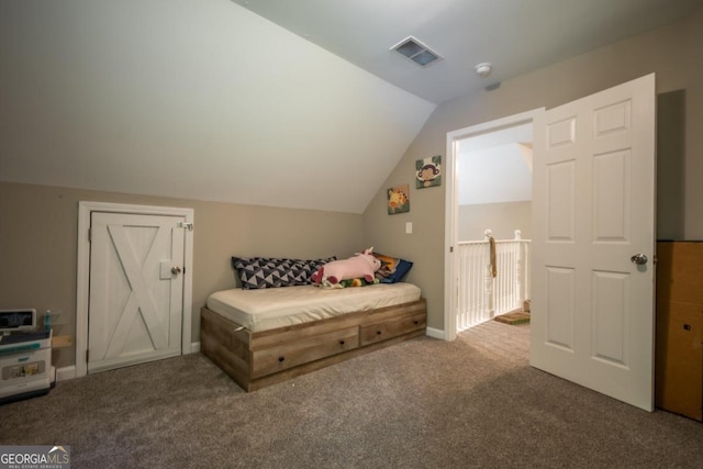 carpeted bedroom featuring vaulted ceiling