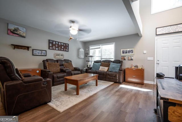 living room with ceiling fan and wood-type flooring