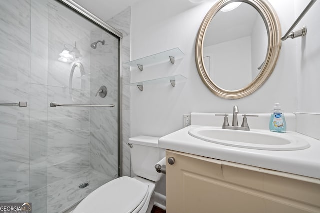 bathroom featuring vanity, toilet, and walk in shower