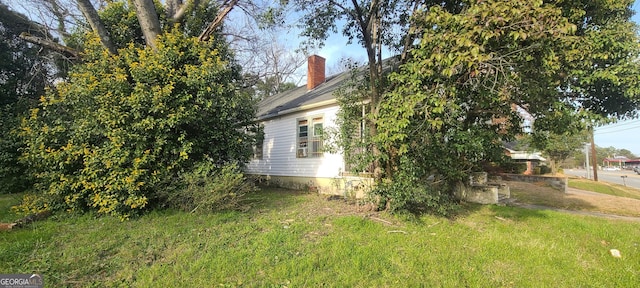 view of home's exterior featuring a lawn