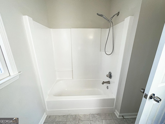 bathroom with tile patterned floors and shower / bathing tub combination