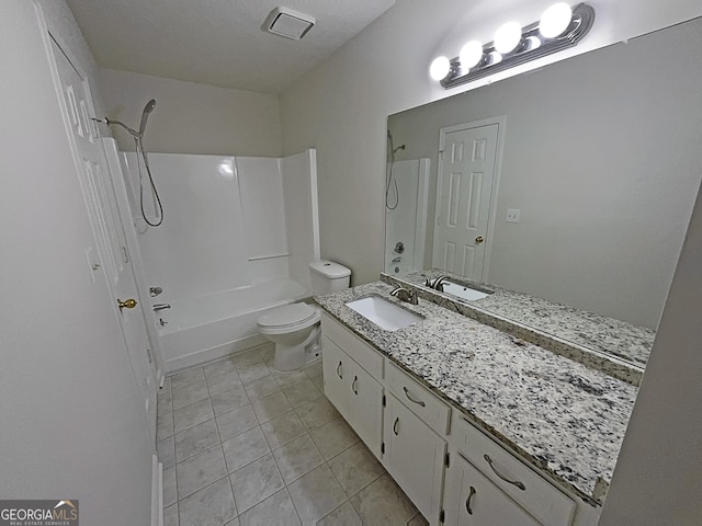 full bathroom featuring vanity, tile patterned flooring, shower / washtub combination, and toilet