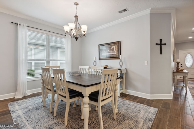 dining area with a healthy amount of sunlight, dark wood-type flooring, a notable chandelier, and ornamental molding