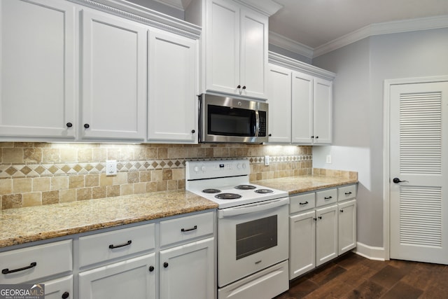 kitchen with white cabinets, ornamental molding, electric range, light stone counters, and dark wood-type flooring