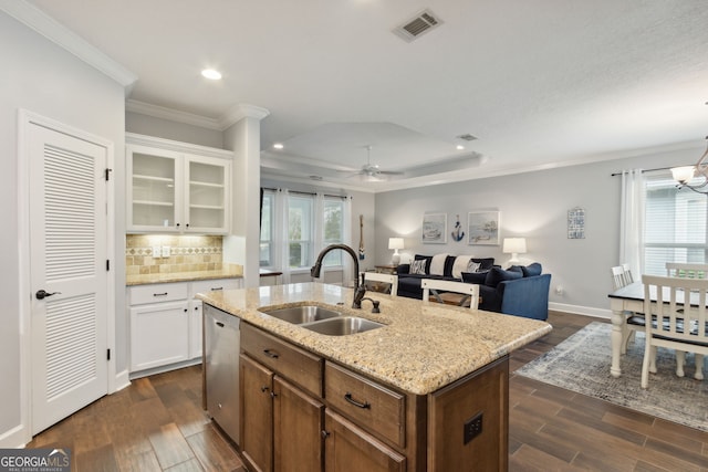 kitchen with an island with sink, sink, white cabinets, and dark hardwood / wood-style floors