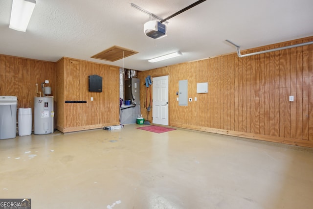 garage with a garage door opener, electric water heater, electric panel, and wooden walls