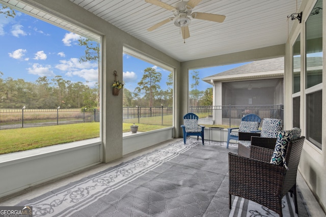 sunroom / solarium with ceiling fan