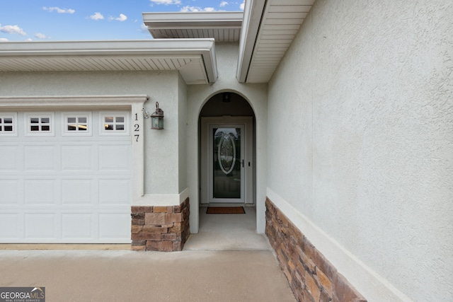 property entrance with a garage