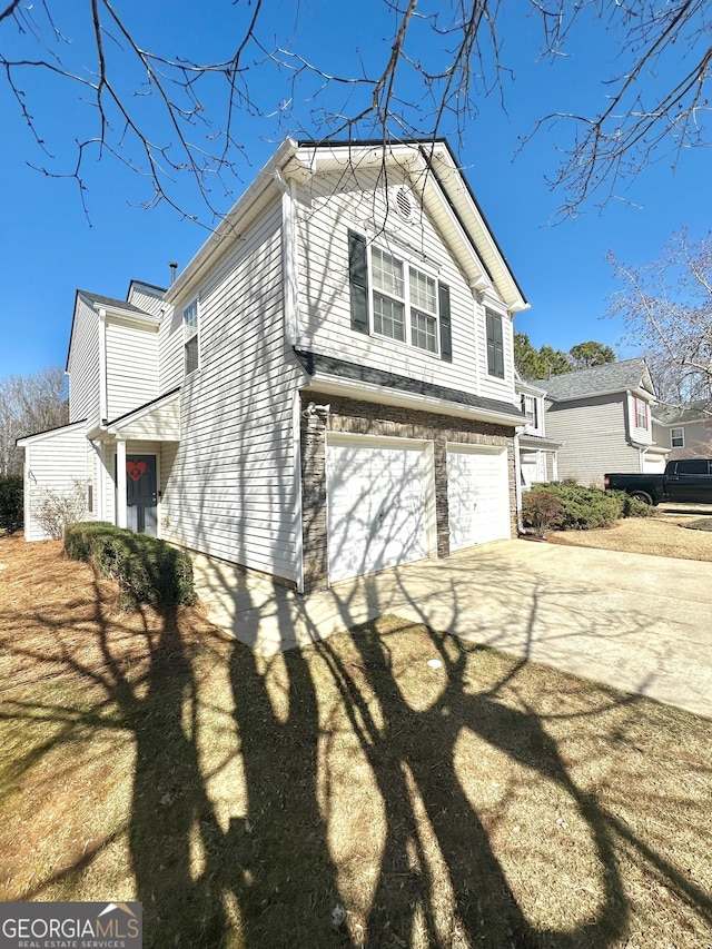 view of property exterior with a garage