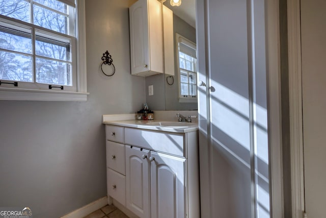 bathroom with vanity and tile patterned flooring