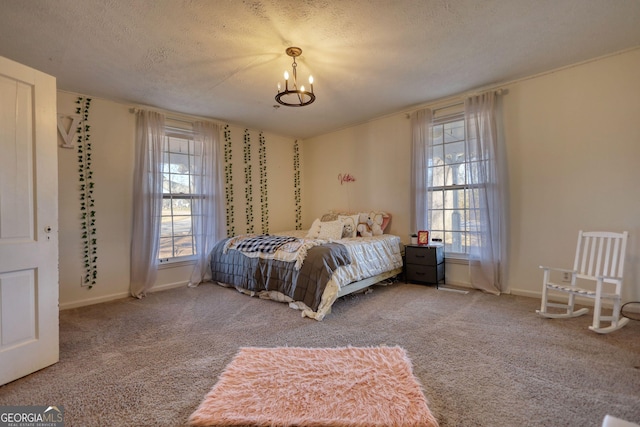 unfurnished bedroom with a chandelier, a textured ceiling, and carpet flooring