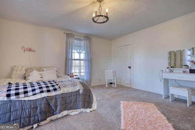 bedroom with an inviting chandelier, light colored carpet, and a textured ceiling