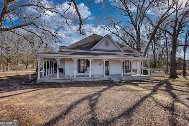 farmhouse-style home featuring a porch