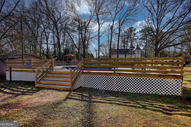 view of yard with a wooden deck