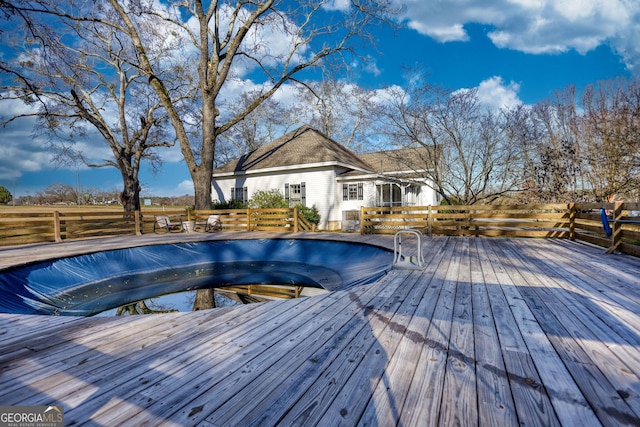 view of pool featuring a wooden deck