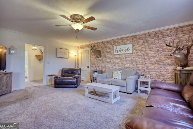 carpeted living room featuring crown molding, a textured ceiling, ceiling fan, and brick wall