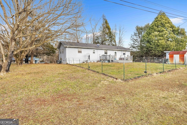 rear view of property with a lawn