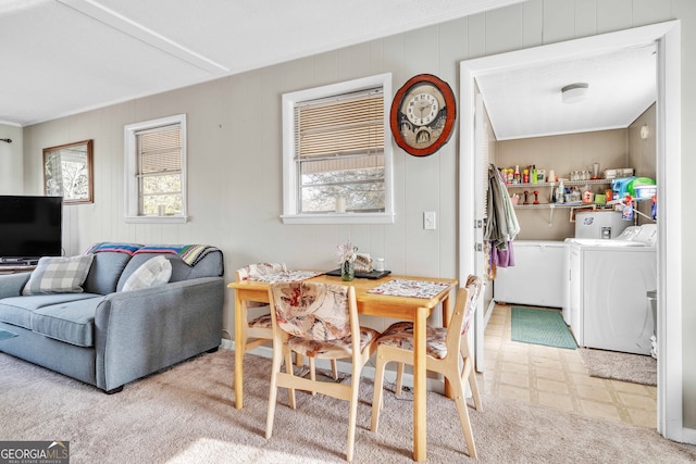 dining space featuring washer and clothes dryer