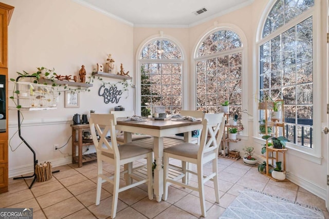 tiled dining space with crown molding