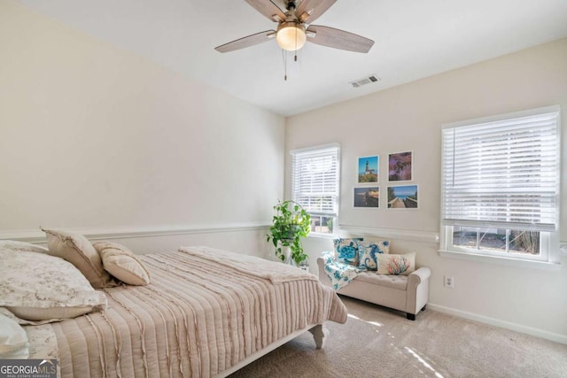 bedroom featuring ceiling fan and light colored carpet