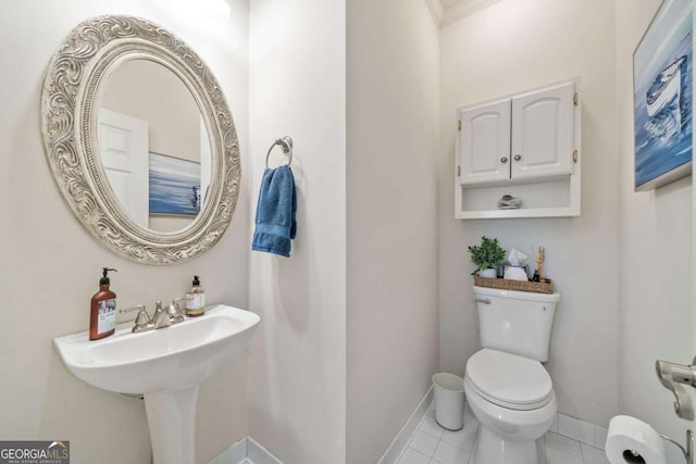 bathroom featuring tile patterned flooring and toilet