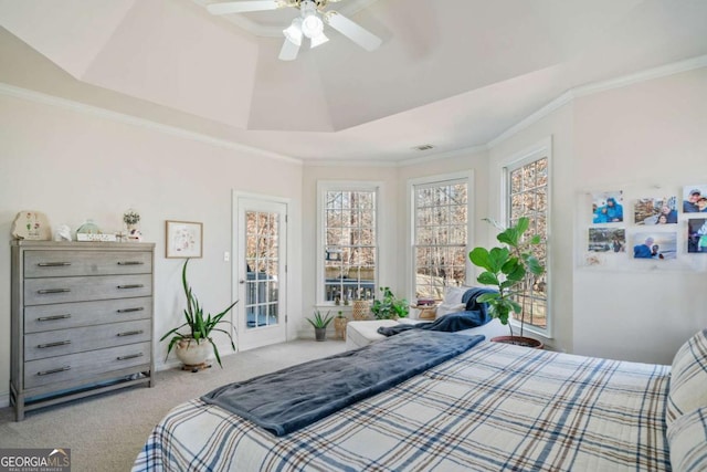 carpeted bedroom with crown molding, access to outside, a raised ceiling, and ceiling fan