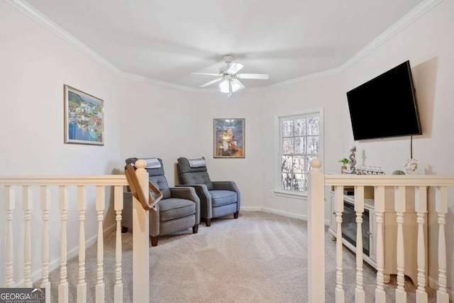 interior space with ceiling fan and ornamental molding