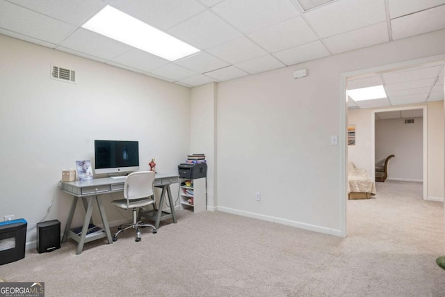 office space with light carpet and a drop ceiling