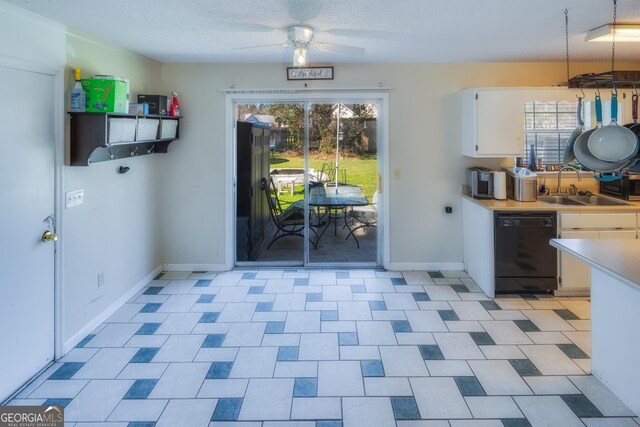 kitchen with sink, white cabinets, stainless steel range with electric cooktop, white refrigerator, and a textured ceiling