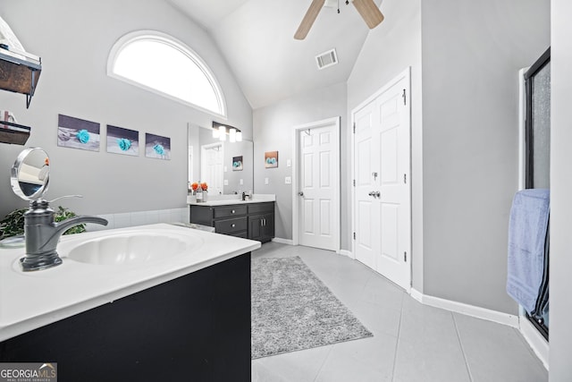 bathroom with ceiling fan, tile patterned floors, vanity, and high vaulted ceiling