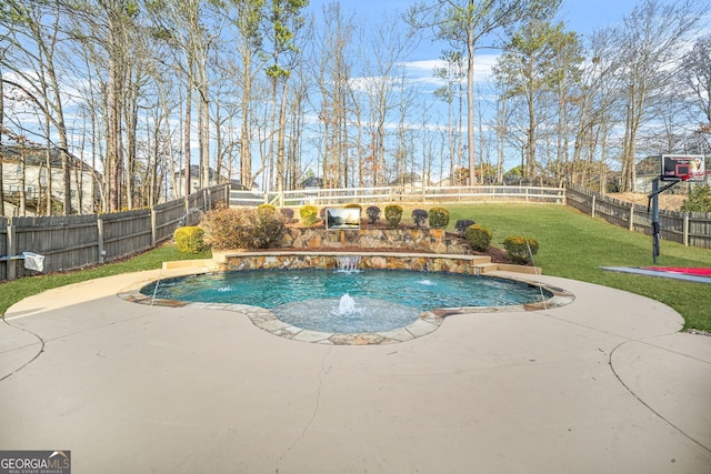 view of pool with a patio, a lawn, and pool water feature