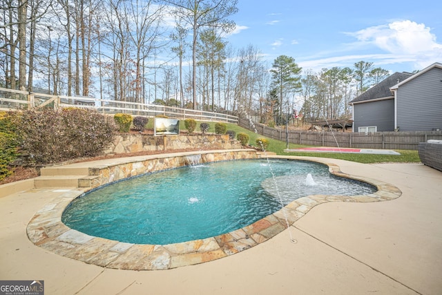 view of swimming pool with a patio area and pool water feature