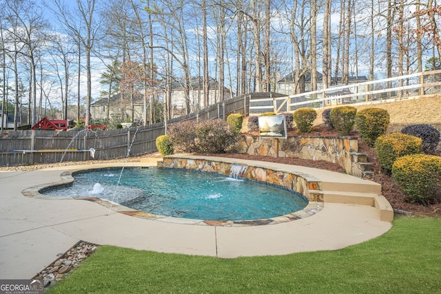 view of pool featuring a patio and pool water feature