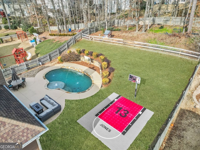 view of pool featuring a playground and a yard