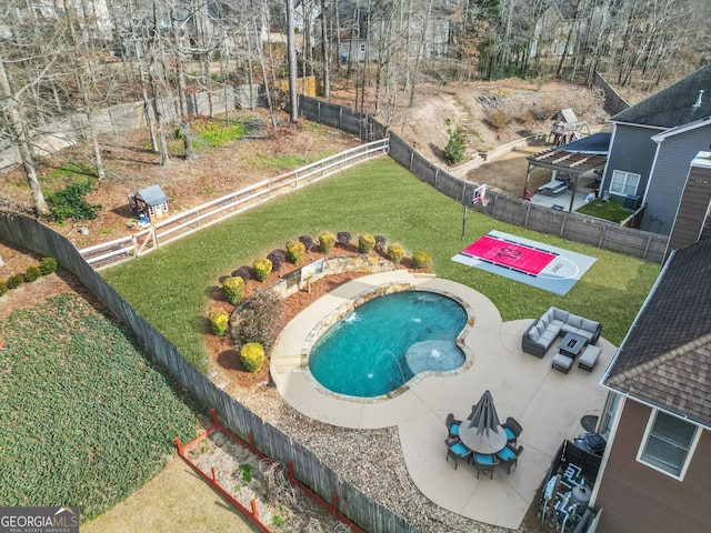 view of pool featuring a patio area and a lawn