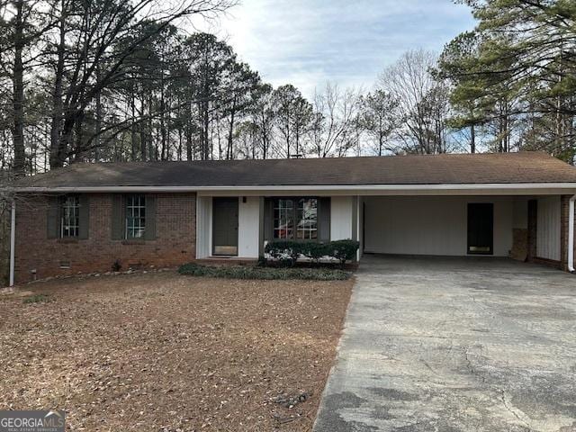 ranch-style house with a carport