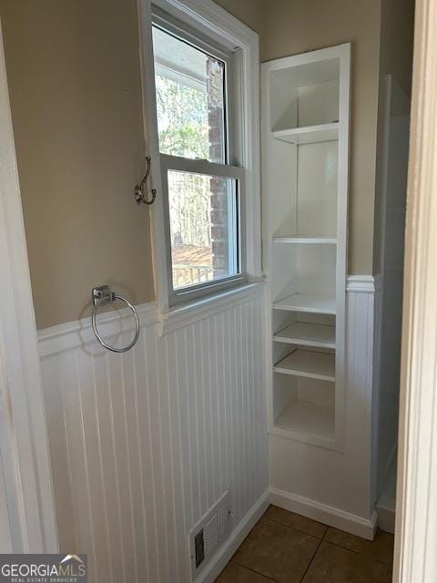 interior space featuring tile patterned flooring and built in features