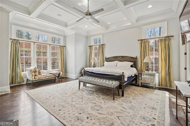 bedroom with dark hardwood / wood-style floors, coffered ceiling, beam ceiling, and a high ceiling