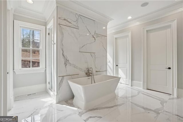 bathroom featuring ornamental molding and separate shower and tub