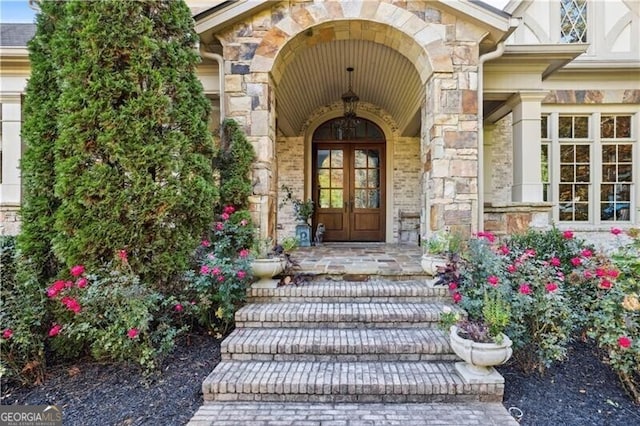 view of exterior entry featuring french doors