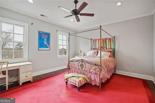 bedroom with crown molding, ceiling fan, and dark hardwood / wood-style flooring